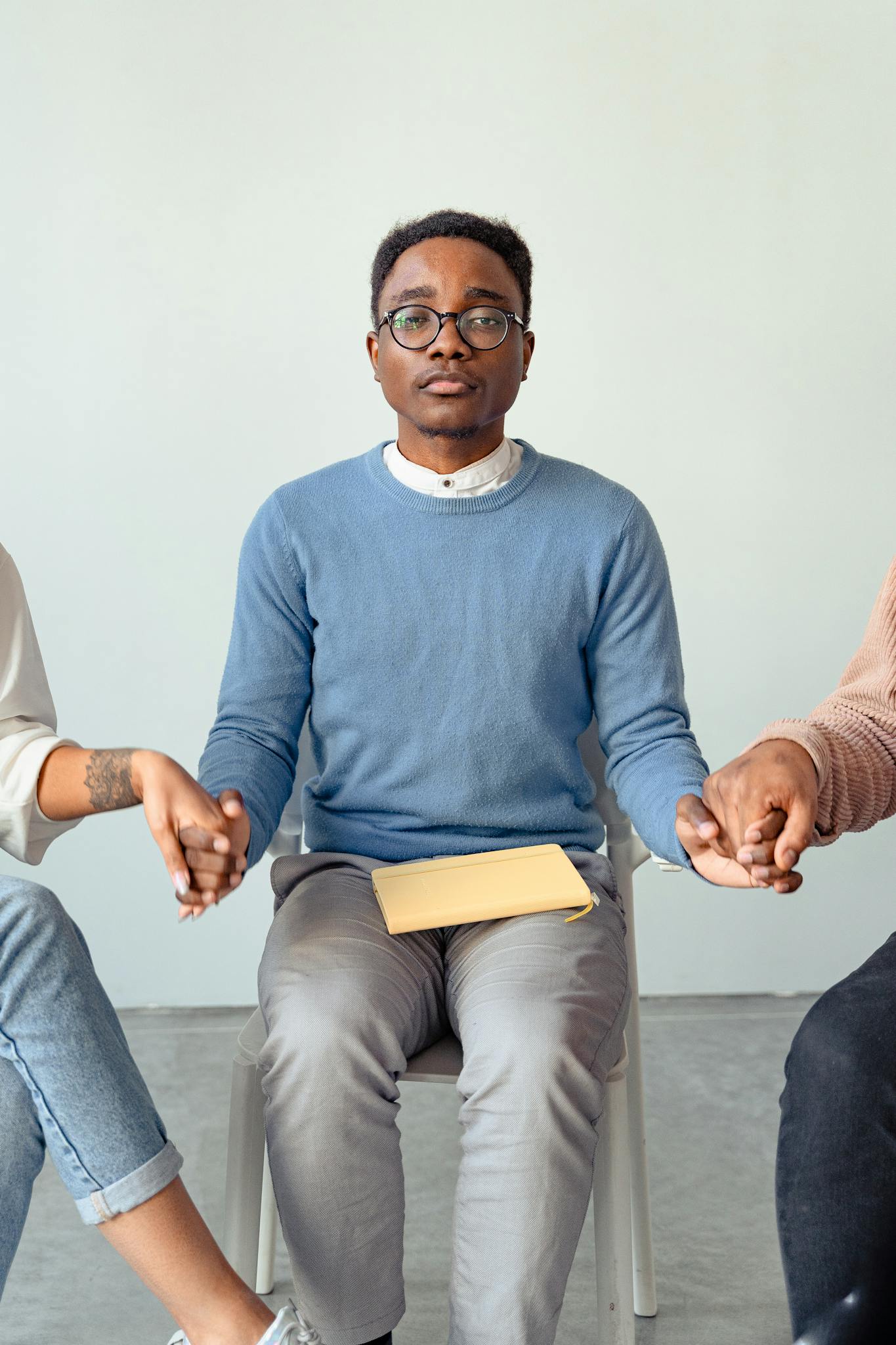 A therapist conducting a supportive group therapy session, indoors, focusing on mental health.